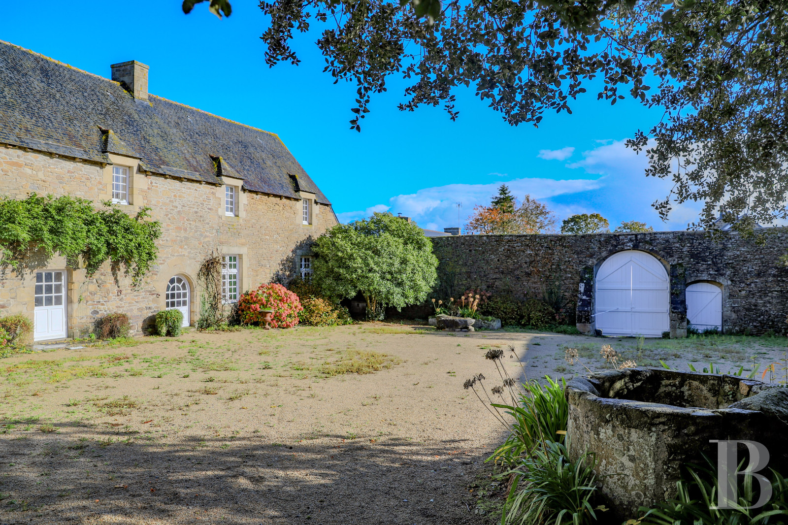 A late 16th century manor house and its outbuildings on an estate of