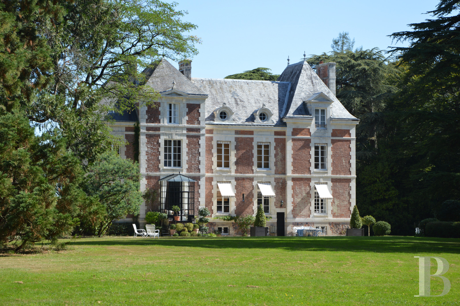 A 19th century chateau and its numerous outbuildings on a peaceful 48