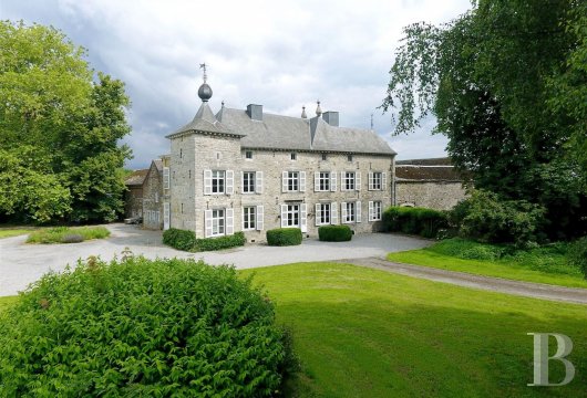 An 18th century chateau and its wooded parklands  in the Meuse Valley and the natural region of Condroz