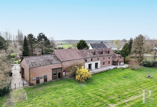 An old farmhouse awaiting renovation, with outbuildings suitable for conversion,  near Charleroi in Wallonia