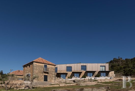 A renovated property with several dwellings that have interiors inspired by wabi sabi style, nestled high up in a 12th-century ...
