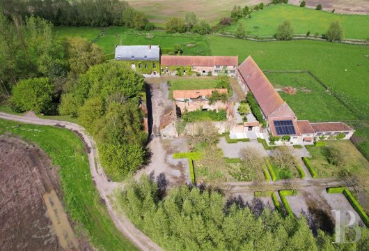 A farm complex with 6 hectares of land and a former abbey cloister,  nestled by the Franco-Belgian border near the city of ...