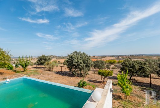 A modern villa with a swimming pool and fenced grounds that cover 4.4 hectares, near the historical town of Alandroal in ...