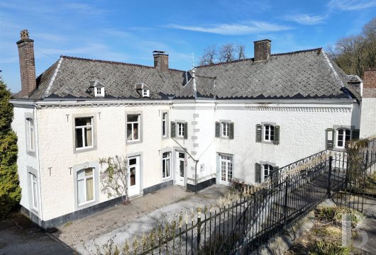 In the province of Namur, a historic house and its bell tower