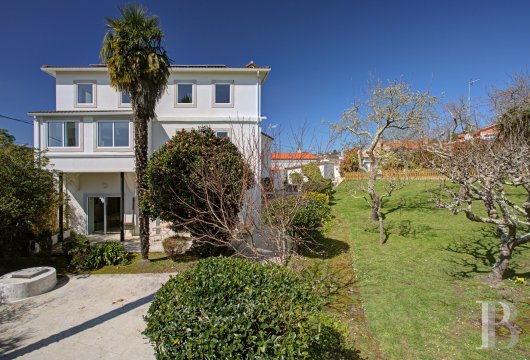 In Galicia, a carefully restored century-old villa, with wooded garden and swimming pool, on the doorstep of La Coruña and ...