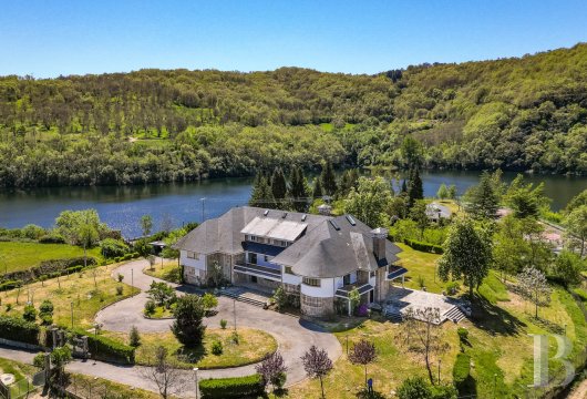 In Spanish Galicia, a 1960s residence with panoramic views over the reservoir and landscaped grounds of around ...