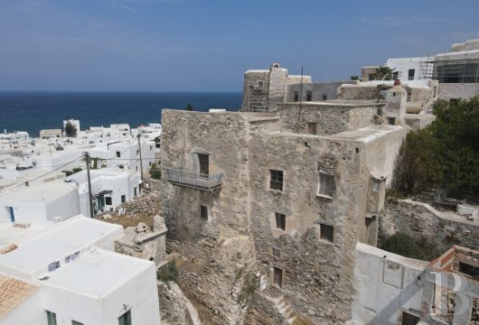 In the Cyclades, in the heart of the historic Kastro of Naxos, a medieval manor house in need of renovation with ...