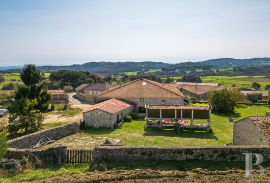 In the valleys of Galicia, near Chantada, a restored old stone farmhouse, its farm outbuildings and gardens in ...