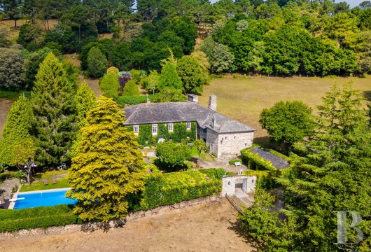 In the Galician countryside, a former stately home and chapel on a vast agricultural estate