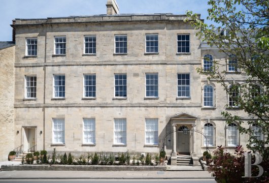 Between London and Bristol, in the former English capital of the Cotswolds, three restored Georgian town houses ...