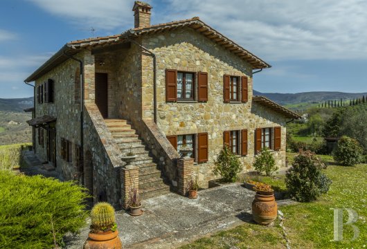 In the heart of Val d'Orcia, a three-storey Tuscan residence with its own olive grove, on the outskirts of San ...