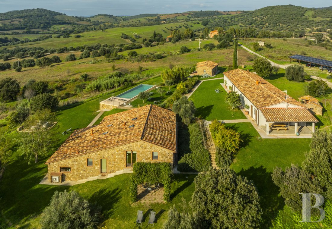 On the outskirts of Campagnatico,<br/>a restored Tuscan residence set on forty-three hectares with olive groves and stone outbuildings.