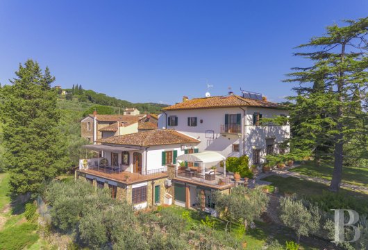 In the Tuscan hills, a restored Renaissance villa, its chapel and grounds with swimming pool