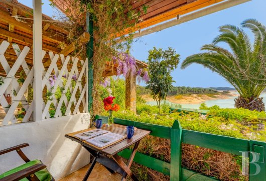 Between Lisbon and Faro, on the banks of the Mira River dam, a welcoming property with terraced gardens and a river ...