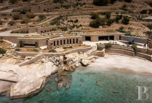 On the island of Kea, a renovated seaside house built on the site of former stone warehouses, with direct access ...