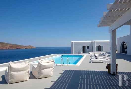 In Mykonos, near Ano Mera, a single-storey villa on wooded grounds close to two coves