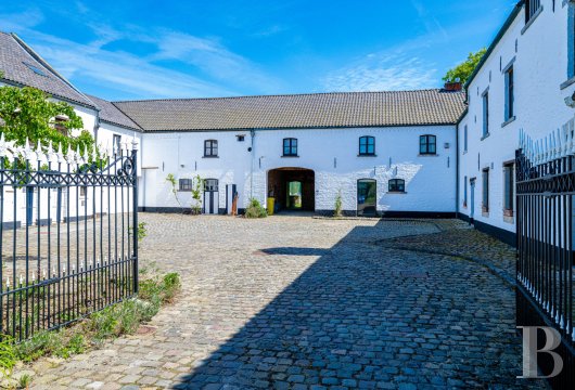 In Walloon Brabant, a 19th-century farm with a main house and separate dwellings