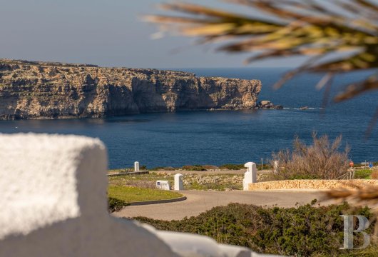In Cala Morell, on the northwest coast of Menorca, a house overlooking the sea