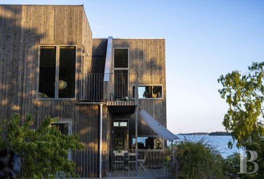 On the island of Oaxen, in Stockholm’s southern archipelago, an architect-designed villa with a guest house and ...