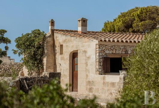 Just a few minutes from Ciutadella, a rustic Menorcan home with two separate units and a view of the sea